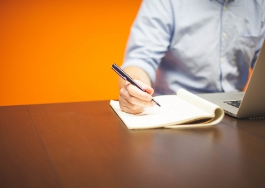 Man writing in notebook