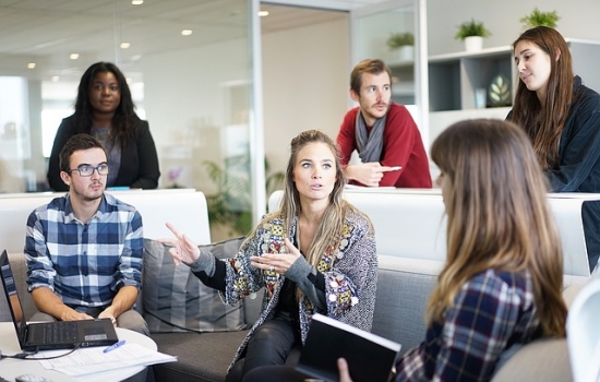 Group of professionals around a computer