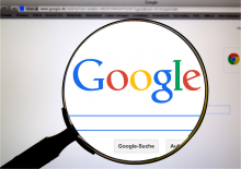 Magnifying glass over the Google logo