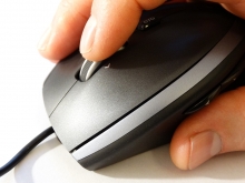 Hand on a computer mouse
