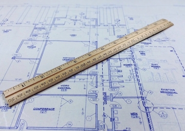Blueprint with ruler on top of it