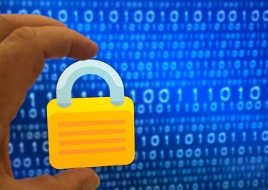 Padlock in front of screen with ones and zeroes