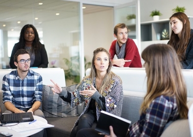 Group of professionals around a computer