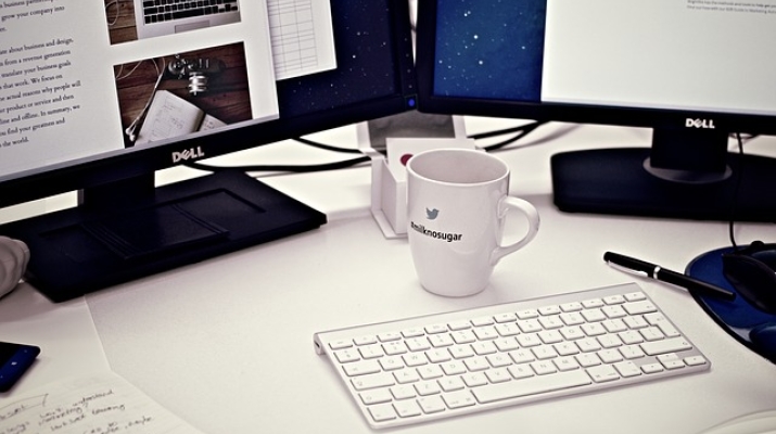 Desk with computer, coffee mug