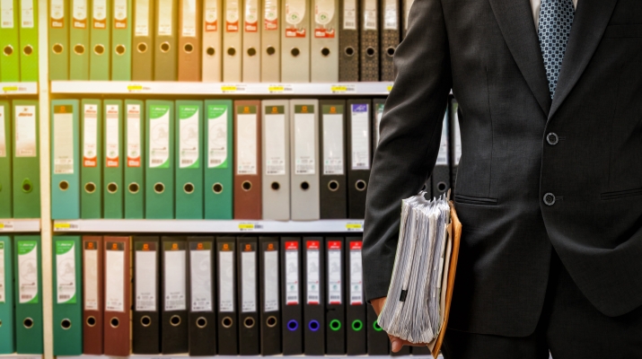 man in front of legal files