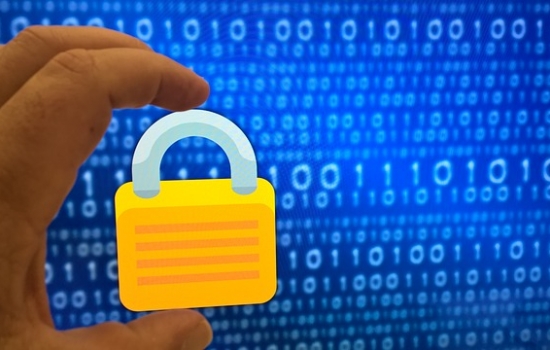 Padlock in front of screen with ones and zeroes