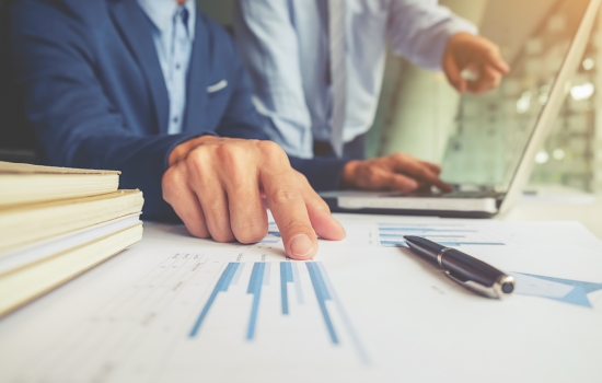 Business owner checking numbers