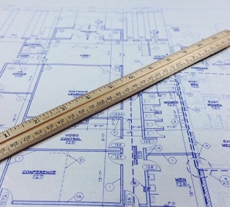 Blueprint with ruler on top of it