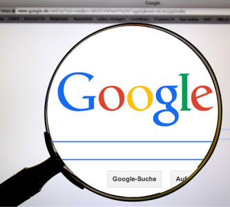 Magnifying glass over the Google logo