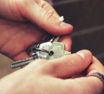 Hands holding keys