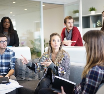 Group of professionals around a computer