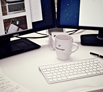 Desk with computer, coffee mug