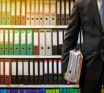 man in front of legal files