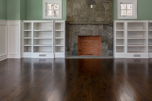 beautiful dark hardwood floor in a living room with a fireplace