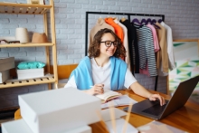 clothing business owner at desk