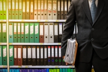 man in front of legal files